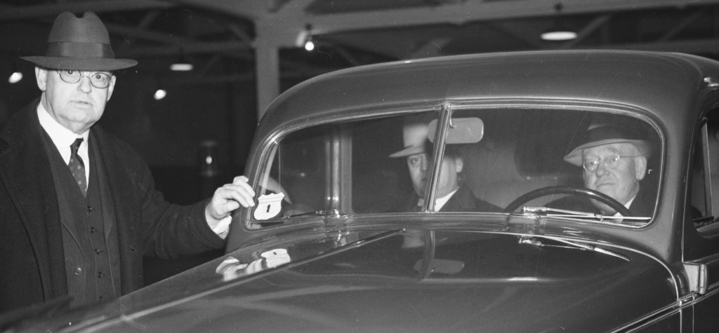 Car being inspected in Seattle's testing garage, 1936