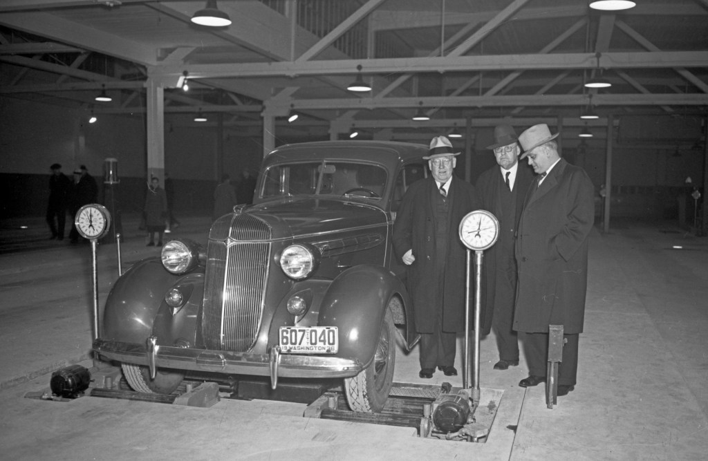 Car being inspected in Seattle's testing garage, 1936