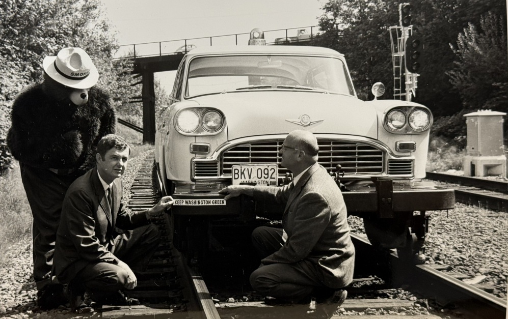 Keep Washington Green bumper sticker applied to Northern Pacific Railroad service car, 1969